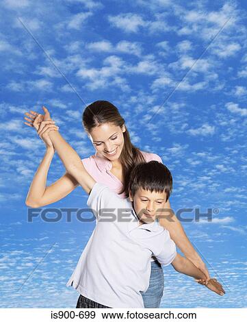 Stock Photo - Mother playing with son. Fotosearch