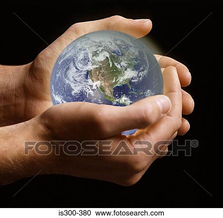 Stock Image - Person holding planet earth. Fotosearch
