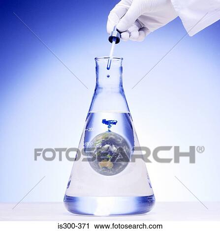 Stock Image - Scientist adding chemical to the world. Fotosearch