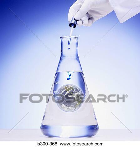 Scientist adding chemical to the world View Large Photo Image Stock Photo - Scientist adding chemical to the world. Fotosearch