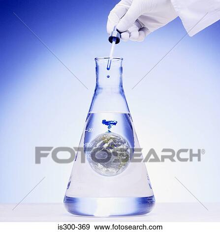 Stock Photo - Scientist adding chemical to the world. Fotosearch