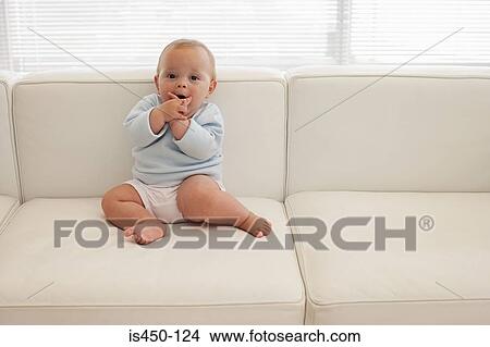 Baby on a sofa View Large Photo Image Picture - Baby on a sofa. Fotosearch