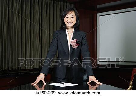 Stock Photo - Businesswoman in conference room. Fotosearch