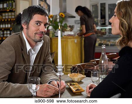 Man and woman sitting in a restaurant View Large Photo Image Stock Photo - Man and woman sitting in a restaurant. Fotosearch