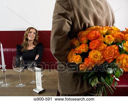 Man arriving at restaurant with bunch of roses View Large Photo Image Stock Image - Man arriving at restaurant with bunch of roses. Fotosearch