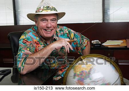 Man in office with globe View Large Photo Image Stock Image - Man in office with globe. Fotosearch