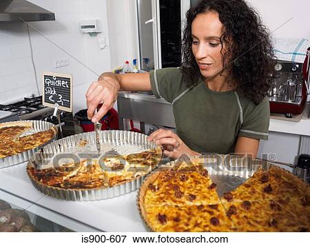 Preparing food in delicatessen kitchen View Large Photo Image Stock Photo - Preparing food in delicatessen kitchen. Fotosearch