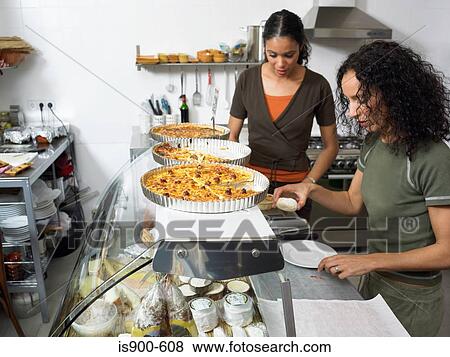 Preparing food in delicatessen kitchen View Large Photo Image Stock Photo - Preparing food in delicatessen kitchen. Fotosearch