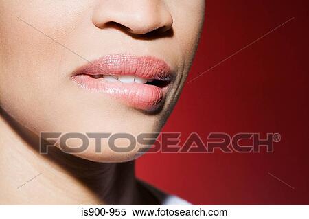 Stock Photography - Woman biting her lip. Fotosearch