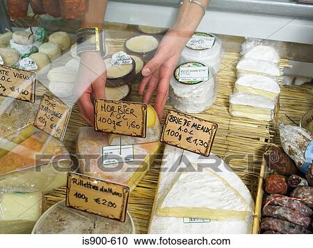 Woman reaching into delicatessen display View Large Photo Image Stock Image - Woman reaching into delicatessen display. Fotosearch