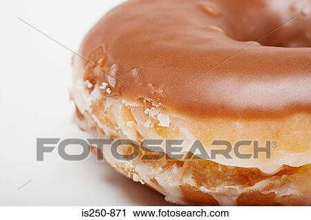 Stock Image - Chocolate glazed doughnut. Fotosearch