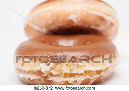 Stock Image - Chocolate glazed doughnut. Fotosearch
