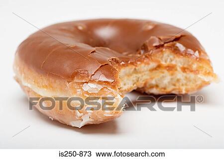 Stock Image - Chocolate glazed doughnut. Fotosearch