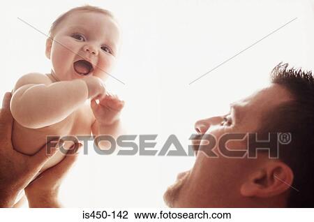 Father holding baby View Large Photo Image Stock Image - Father holding baby. Fotosearch