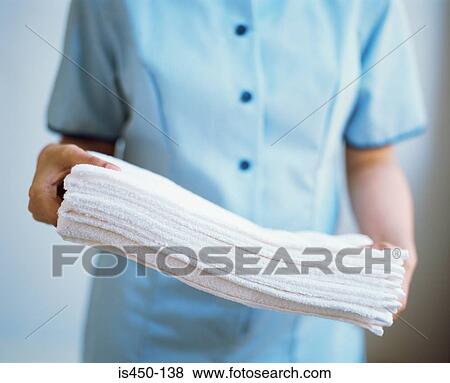 Stock Photo - Maid carrying towels. Fotosearch
