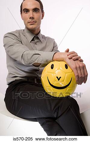 Businessman with football View Large Photo Image Stock Photography - Businessman with football. Fotosearch