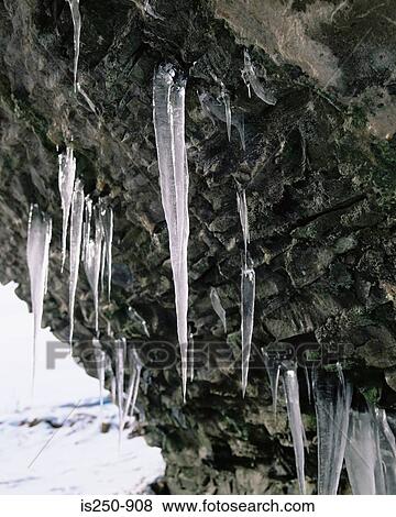 Stock Photo - Icicles underneath old bridge stow scotland. Fotosearch