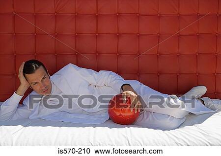 Stylish man with football View Large Photo Image Stock Image - Stylish man with football. Fotosearch