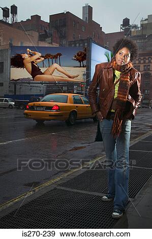 Woman on street daydreaming View Large Photo Image Stock Photo - Woman on street daydreaming. Fotosearch