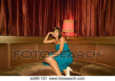 Stock Image - Young woman in a nightclub. Fotosearch