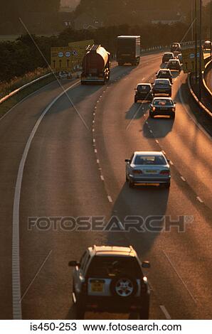 A highway at sunset View Large Photo Image Stock Image - A highway at sunset. Fotosearch