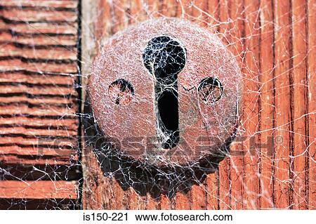 A keyhole covered in cobwebs View Large Photo Image Stock Image - A keyhole covered in cobwebs. Fotosearch