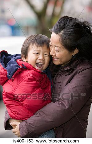 Happy boy with mother View Large Photo Image Stock Image - Happy boy with mother. Fotosearch