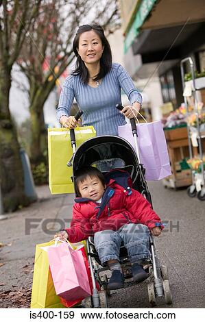 Stock Photo - Mother and toddler out shopping. Fotosearch