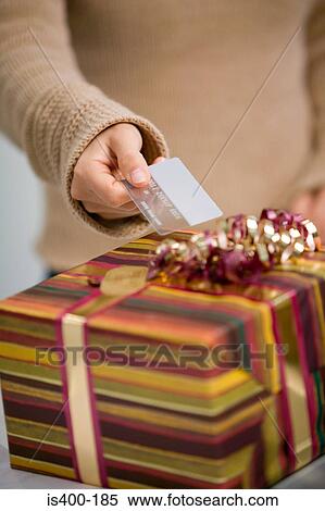 Paying for gift with credit card View Large Photo Image Stock Photography - Paying for gift with credit card. Fotosearch