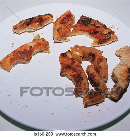 Pizza crusts leftover View Large Photo Image Stock Photo - Pizza crusts leftover. Fotosearch
