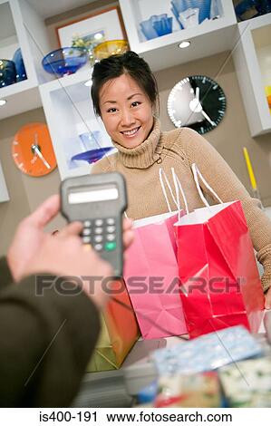 Shop assistant and customer View Large Photo Image Stock Image - Shop assistant and customer. Fotosearch