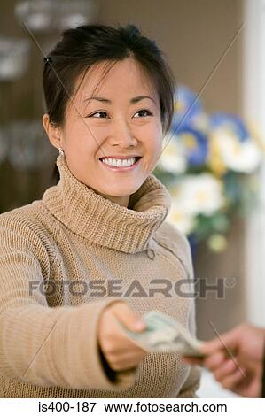 Stock Photo - Woman paying. Fotosearch