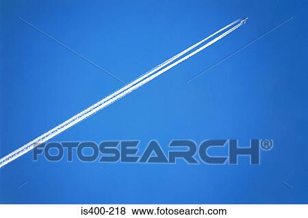 Aeroplane with vapour trail View Large Photo Image Stock Photo - Aeroplane with vapour trail. Fotosearch