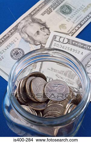 Banknotes and coins in a jar View Large Photo Image Picture - Banknotes and coins in a jar. Fotosearch