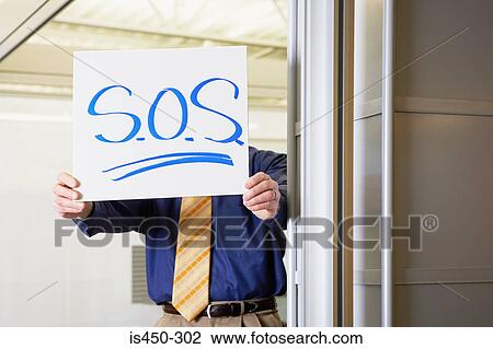 Man holding sos sign View Large Photo Image Stock Image - Man holding sos sign. Fotosearch