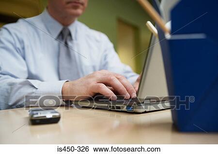 Man working at desk with takeout View Large Photo Image Stock Photograph - Man working at desk with takeout. Fotosearch