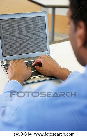 Man working on laptop View Large Photo Image Picture - Man working on laptop. Fotosearch