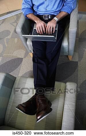 Office worker on chairs with laptop View Large Photo Image Stock Image - Office worker on chairs with laptop. Fotosearch