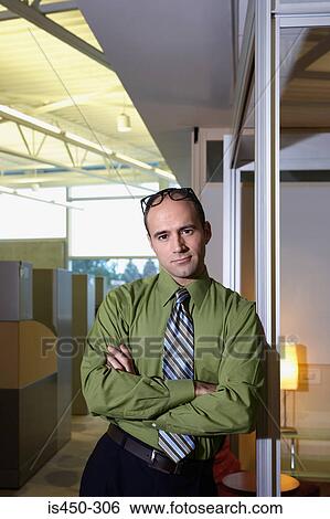 Stock Photograph - Office worker with arms crossed. Fotosearch