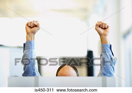 Office worker with raised fists View Large Photo Image Stock Image - Office worker with raised fists. Fotosearch
