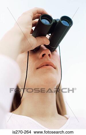Picture - Person with binoculars. Fotosearch