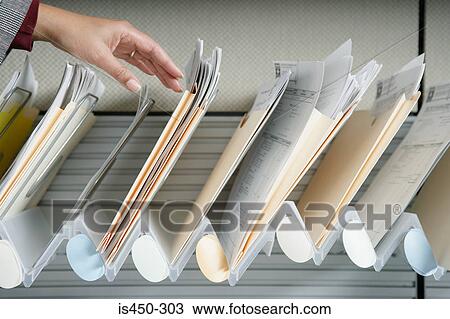 Woman filing View Large Photo Image Stock Image - Woman filing. Fotosearch