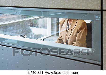Woman in office cubicle View Large Photo Image Stock Image - Woman in office cubicle. Fotosearch