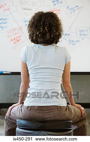Woman looking at whiteboard View Large Photo Image Stock Image - Woman looking at whiteboard. Fotosearch