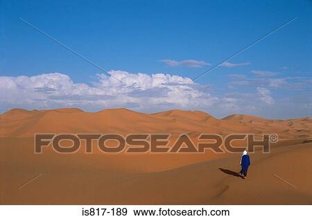 Person walking in the sahara desert View Large Photo Image Stock Photo - Person walking in the sahara desert. Fotosearch