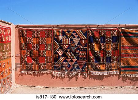 Stock Image - Rugs hanging on a wall. Fotosearch