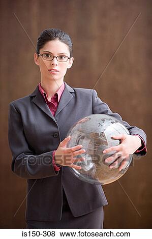 Businesswoman holding inflatable globe View Large Photo Image Stock Photo - Businesswoman holding inflatable globe. Fotosearch