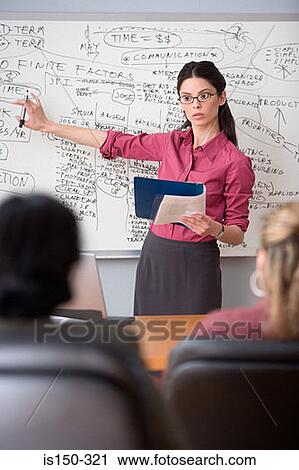 Woman giving a presentation View Large Photo Image Stock Image - Woman giving a presentation. Fotosearch