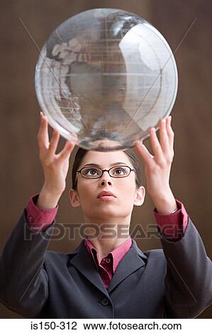 Woman holding an inflatable globe View Large Photo Image Stock Image - Woman holding an inflatable globe. Fotosearch
