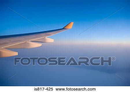 Aeroplane in the clouds View Large Photo Image Stock Photography - Aeroplane in the clouds. Fotosearch